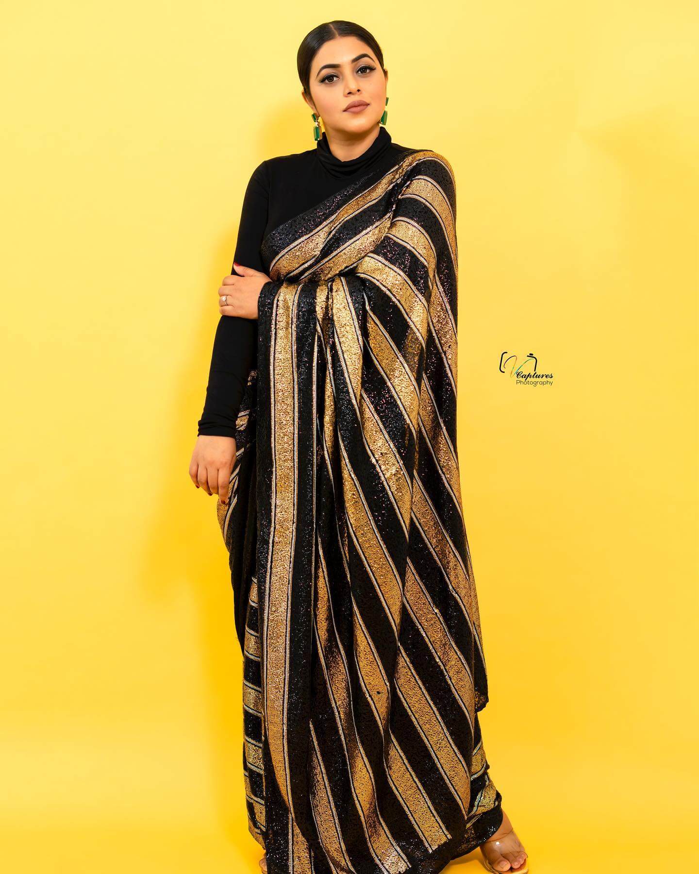 Shamna Kasim In  Black & Golden Glittery Stripped Saree Paired With High Neck Black Blouse