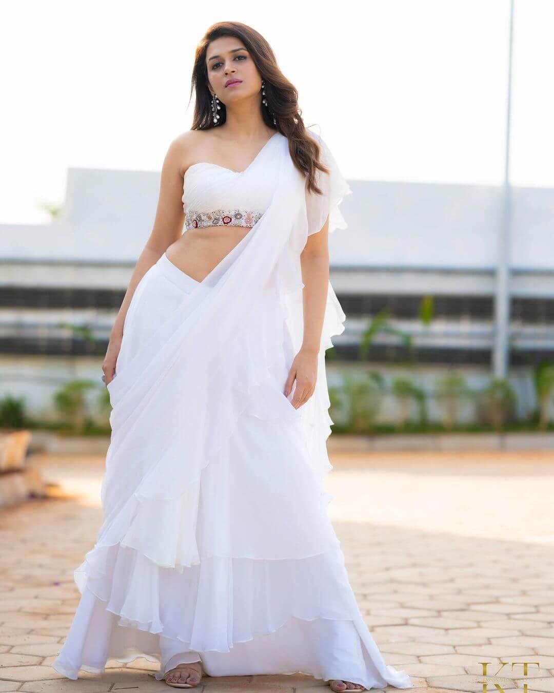 Shraddha Das In White Ruffled Saree With One Side Shoulder Blouse