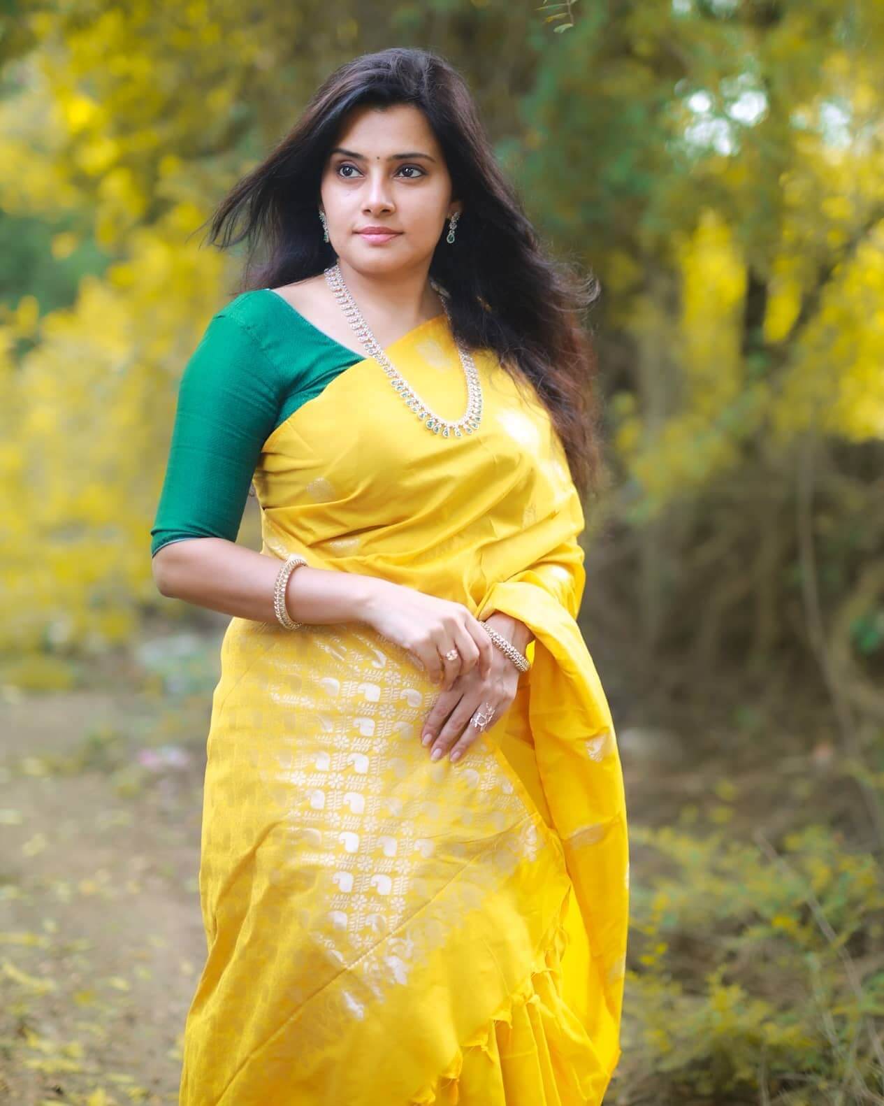 Shruthi Raj In Bright Yellow Silk Saree Paired With Green Contrasting Blouse