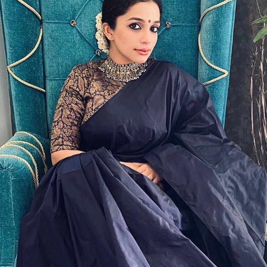 Ann Augustine In Solid Black Saree With Golden Embellished Blouse Styled With Oxidised Jewellery