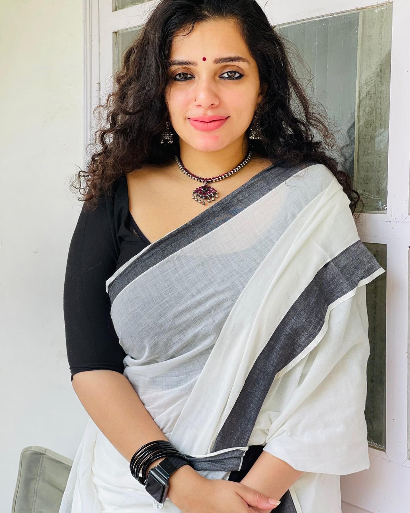 Ann Augustine In White & Black Saree Paired With Black Blouse