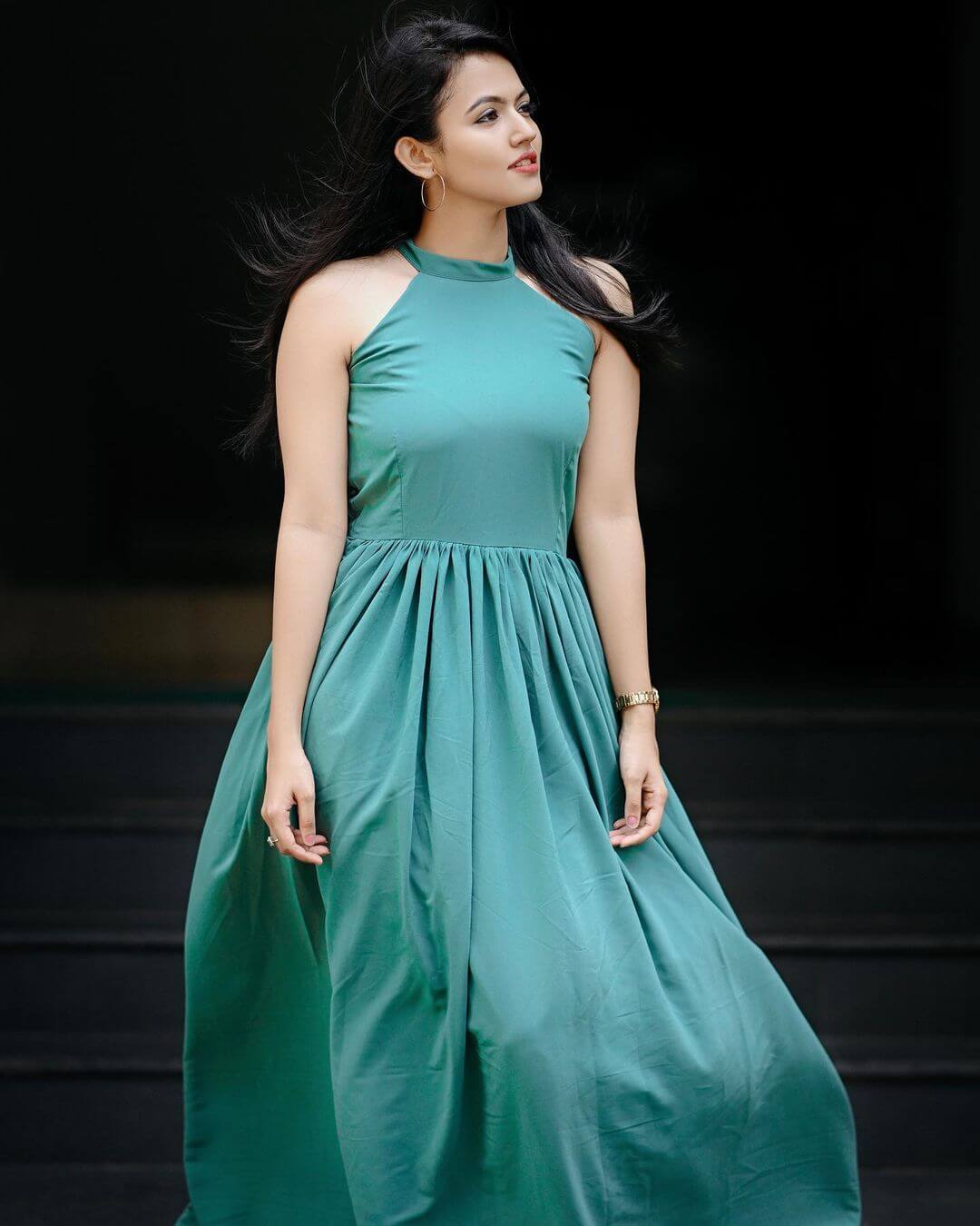 Aparna Das Look Fabulous In a Green Halter Neck Solid Maxi Dress With Hoops Earrings - Festive Outfits & Looks