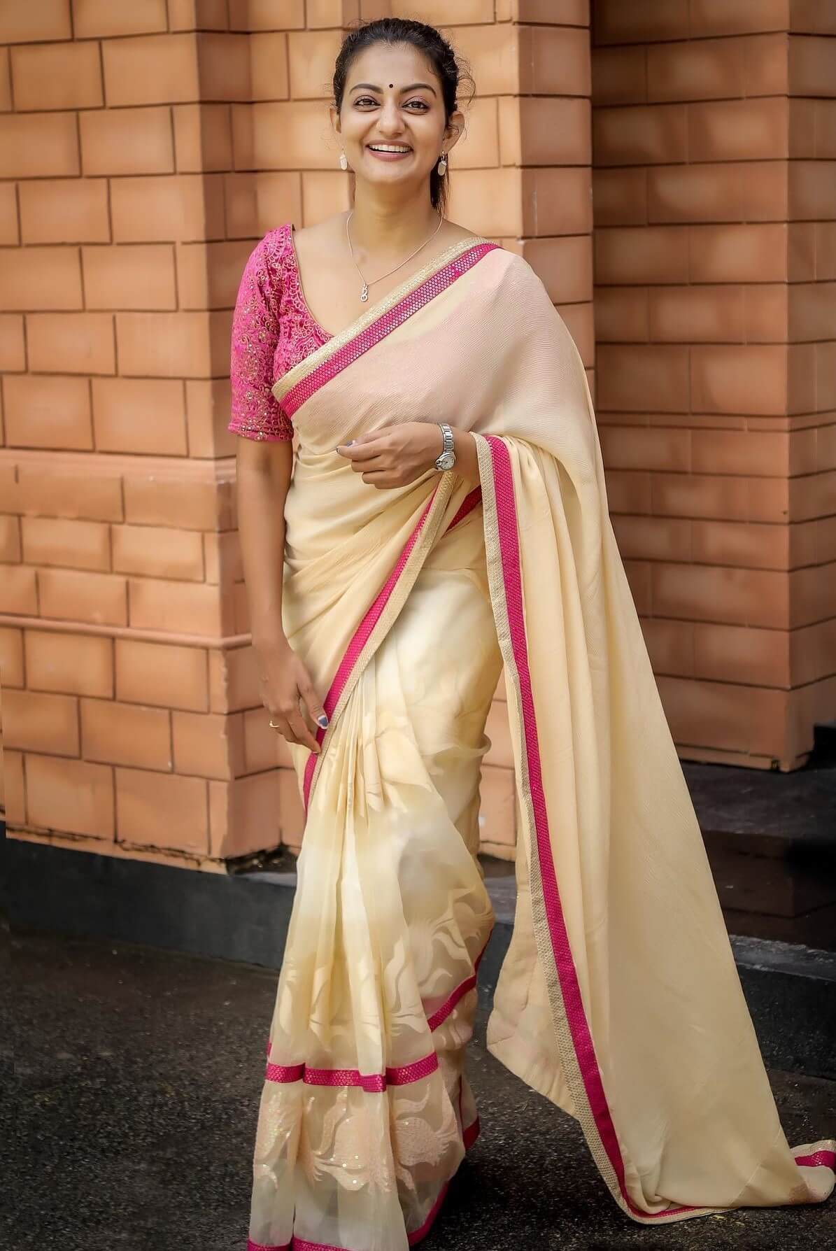 Beautiful Priyanka Nair In Light Pink Saree With Sequined Border Paired With Dark Pink Blouse