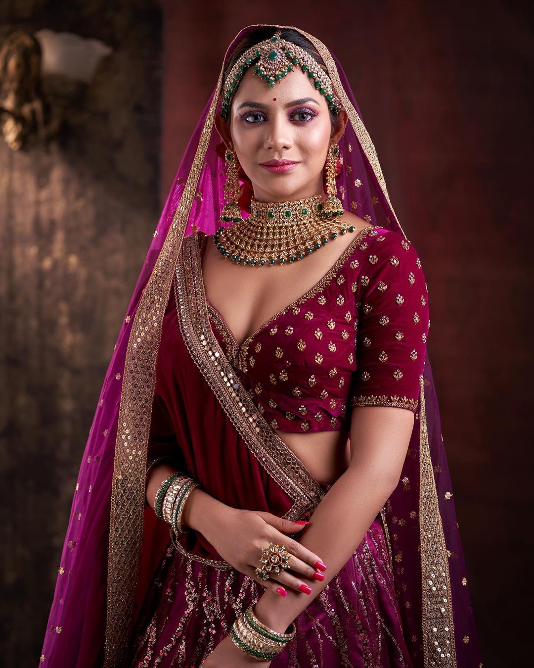 Diva Aishwarya Dutta In Regal Rosewood Velvet & Net Heavy Embellished Lehenga With Kundan Green Beads Bridal Jewellery Exclusive Outfits & Looks