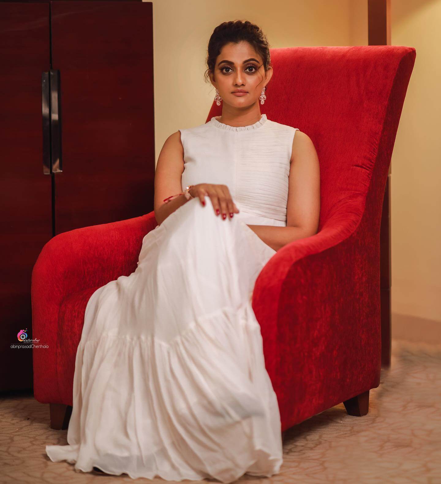 Gorgeous Priyanka Nair In Chic White Long Dress With Messy Bun Hairstyle