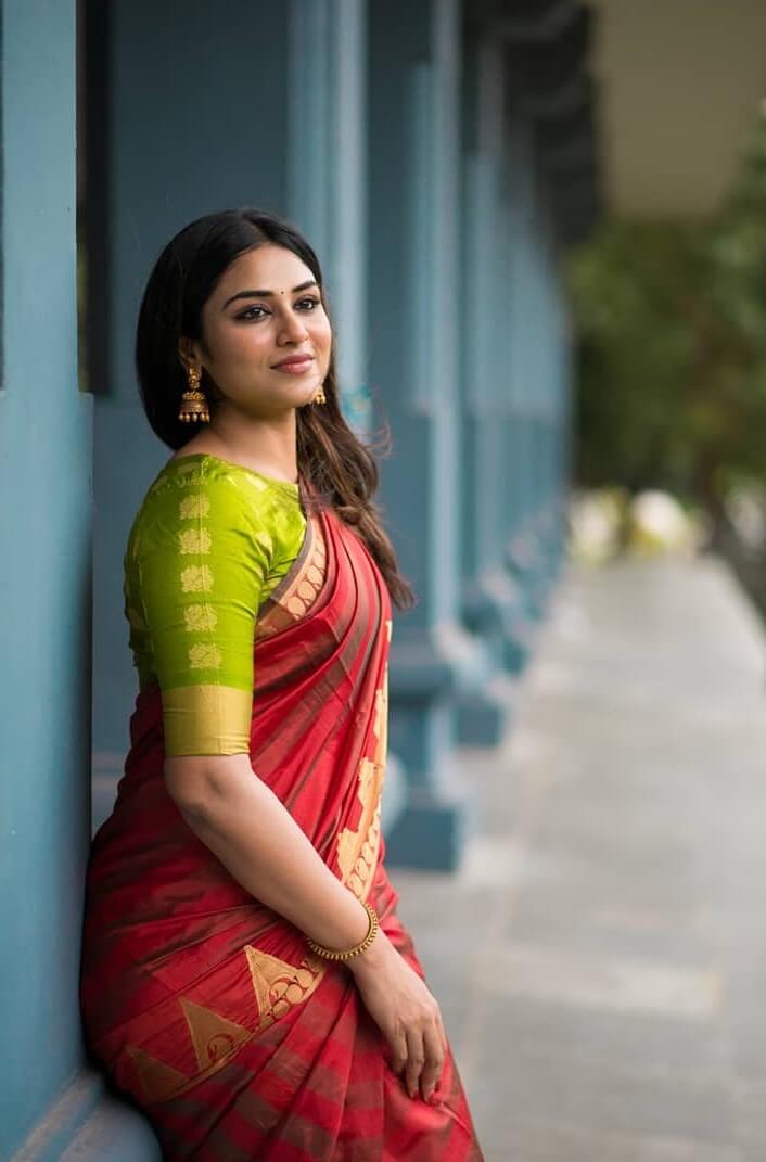 Indhuja In Traditional Red Silk Saree Paired With Green Blouse