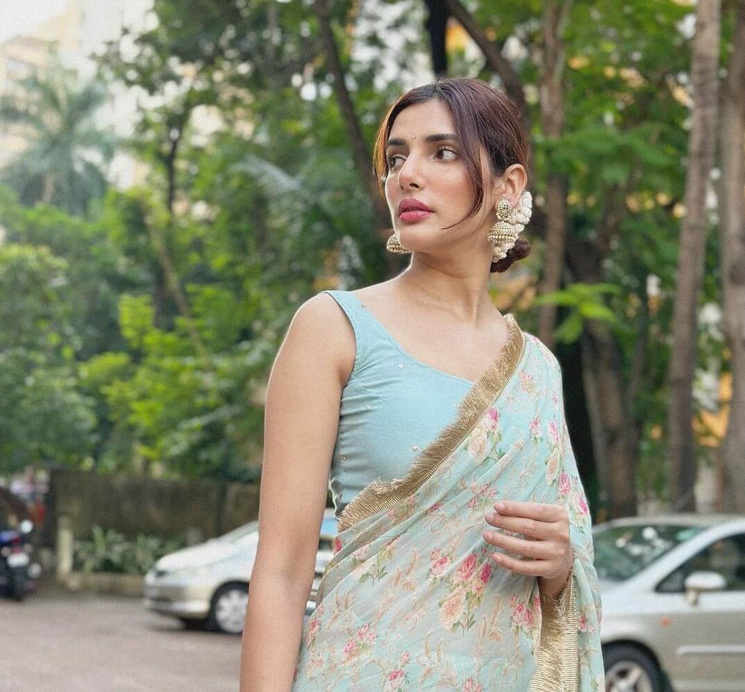 Indian Actress Natasha Singh In a Light Blue Floral Printed Gotta Patti Border Saree With Sleeveless Blouse Is Perfect Bridesmaid Look