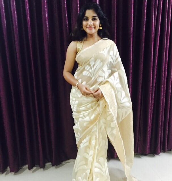 Jai Lava Kusa Fame Nivetha Thomas  In White Printed Saree With Golden Sleeveless Blouse Traditional Outfits & Looks