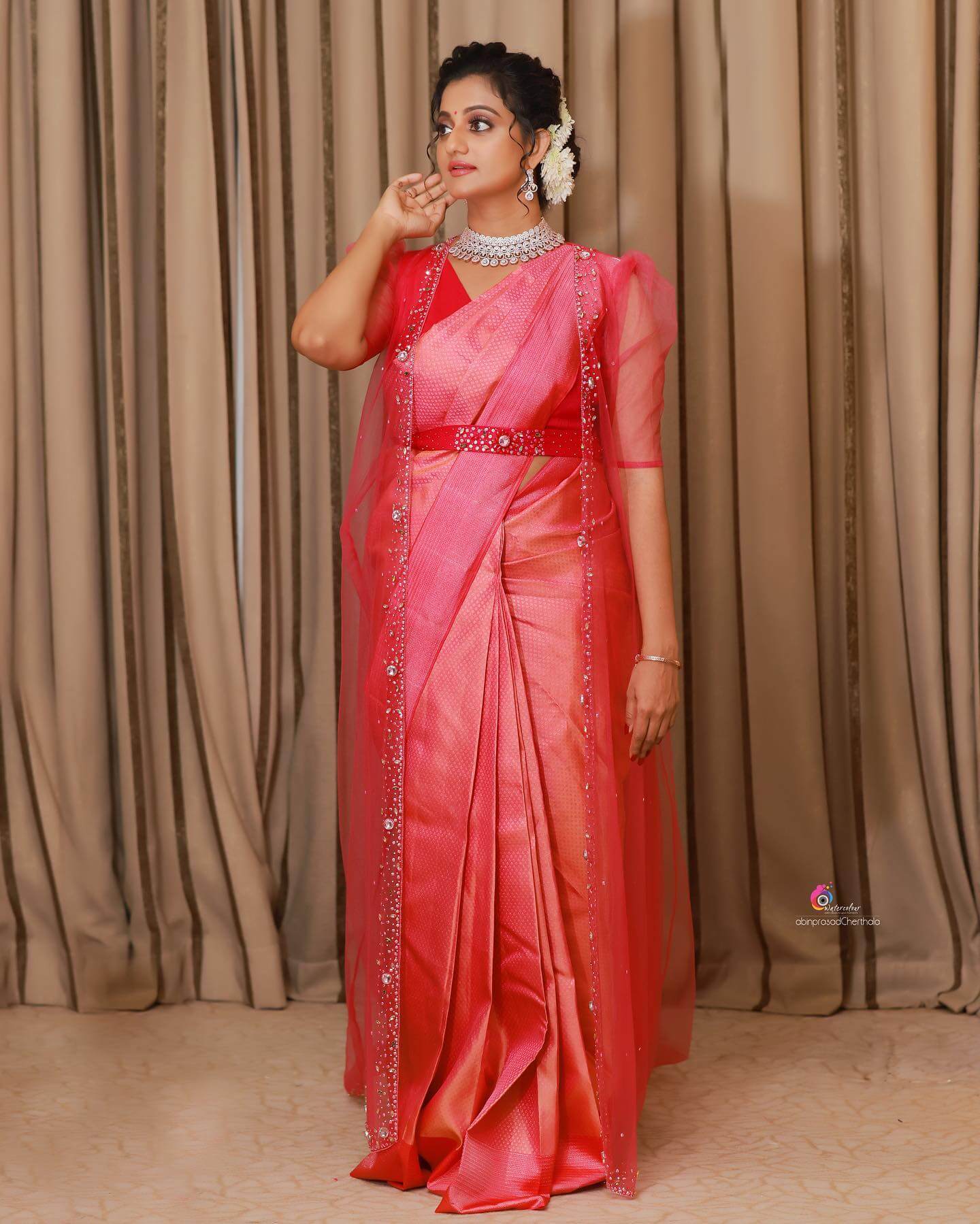 Kollywood Actress Priyanka Nair  In Pink Kajeevaram Silk Saree Styled With  Net Long Puffed Sleeves Net Shrug With Diamond Jewellery