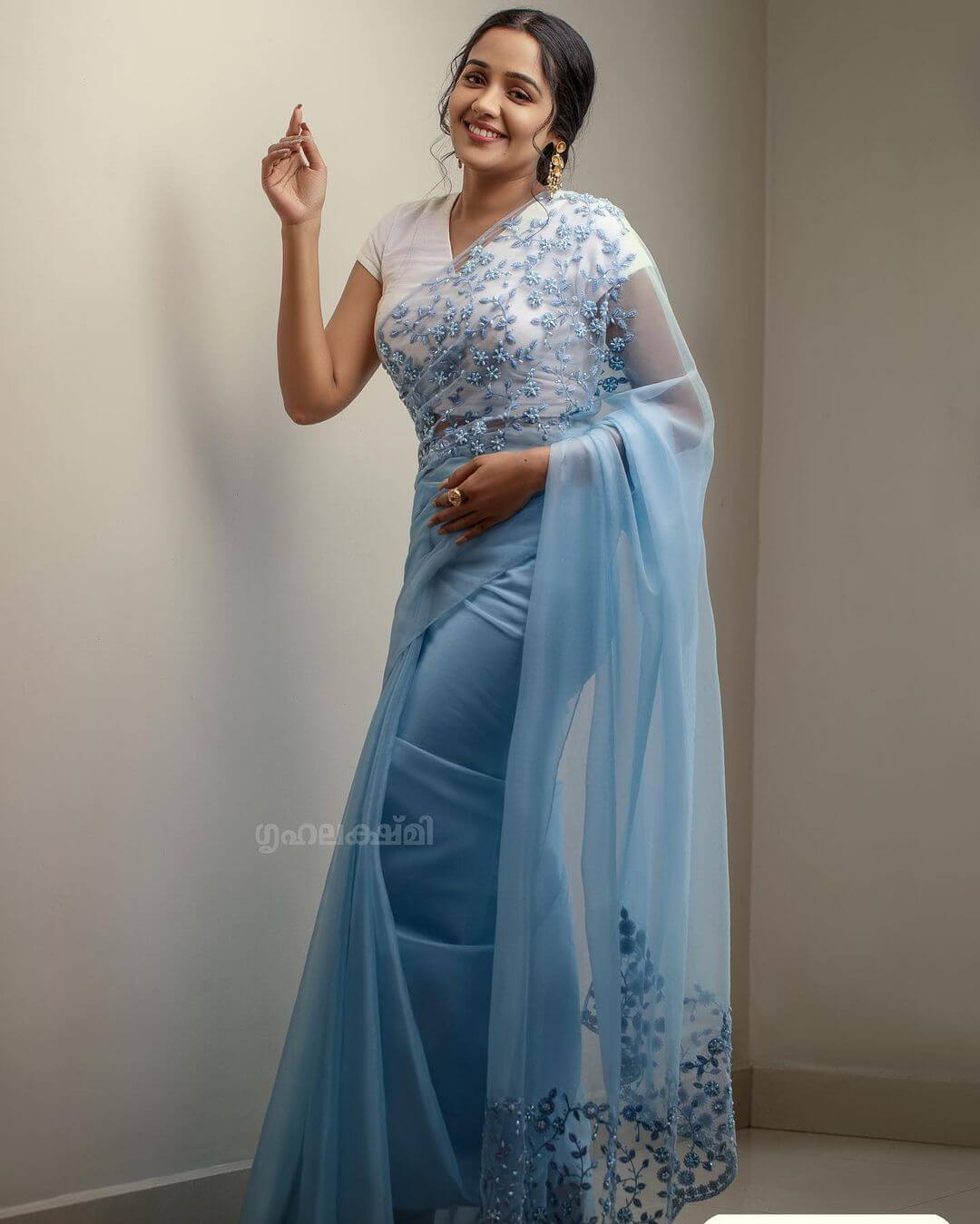 Naadodigal Fame Ayilya Nair In Baby Blue Net Embroidered Saree Paired With White Half Sleeves Blouse