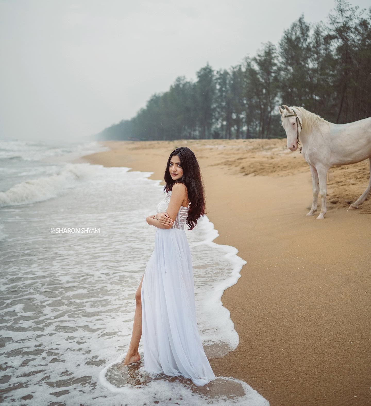 Nandana Varma Sways With Perfect Beach In White Long Maxi Dress With Slit Cut