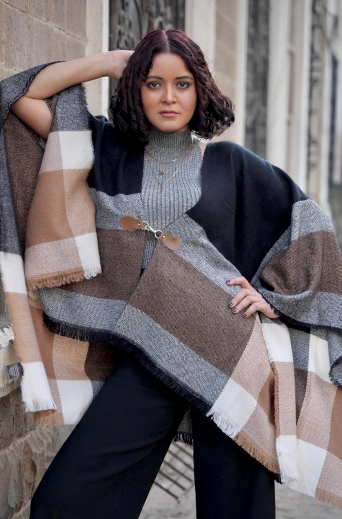 Parvathi Nirban In Buffalo Plaid Blanket Poncho Paired With Black Flared Pants Chic & Cool Stylish Outfits & Looks