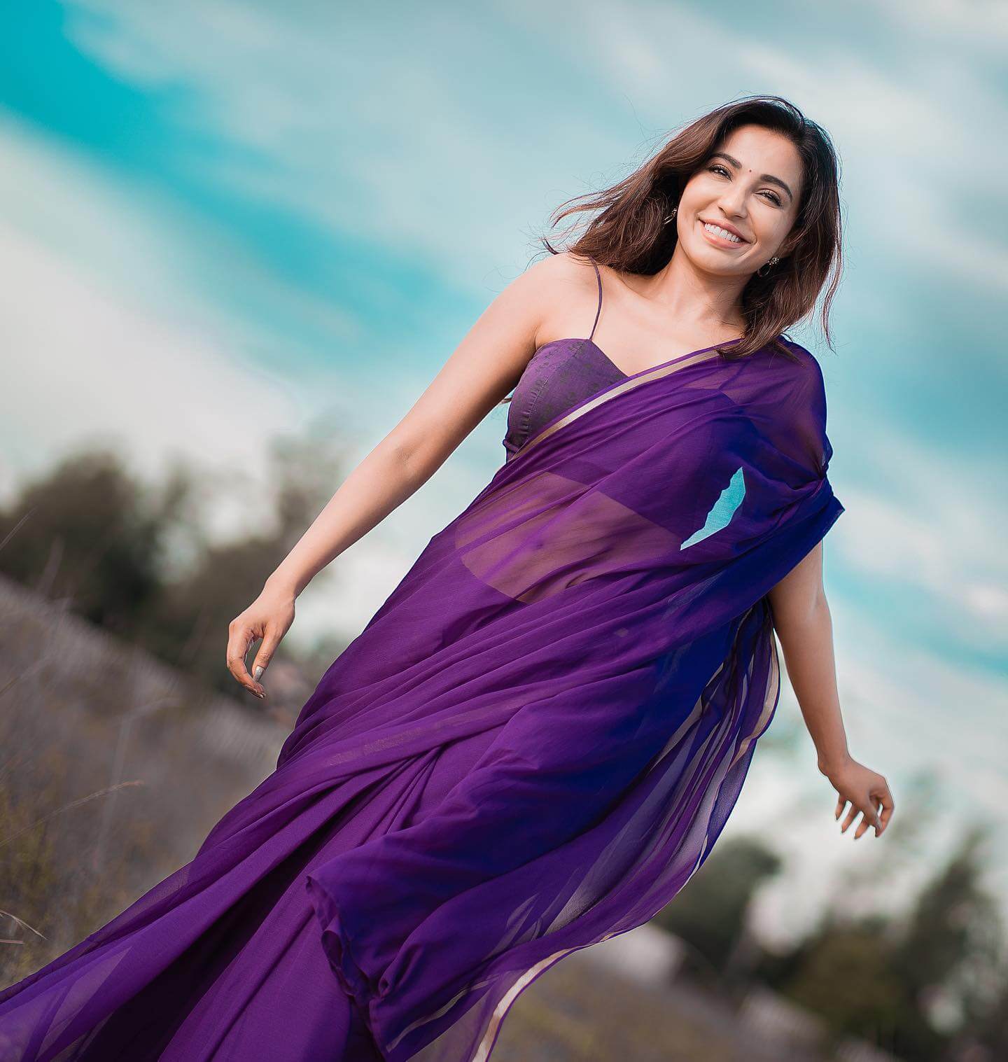 Parvathy Nair Look Beautiful In Purple Solid Chiffon Saree With Noddle Strap Blouse