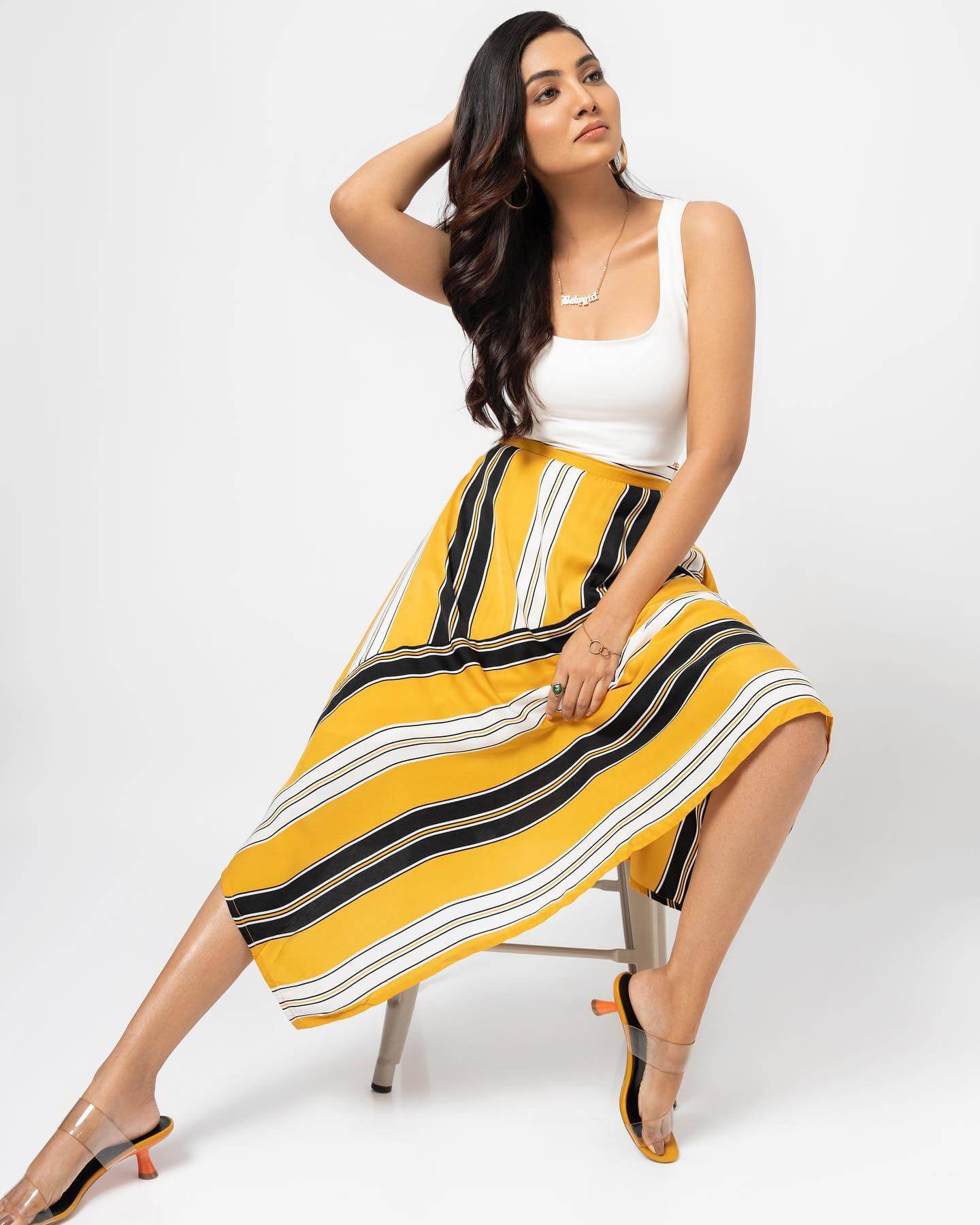 South Actress Swathi Muppala In White Tank Top With Printed Yellow Skirt Simple Yet Sexy Trendy Outfits & Looks