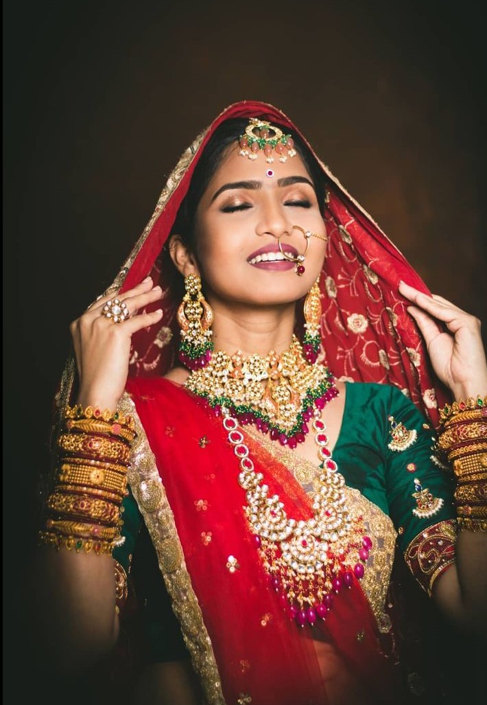 South Actress Venba Desi Bridal Look In Red Lehenga With Green Blouse Paired With Heavy Kundan & Polki Set 