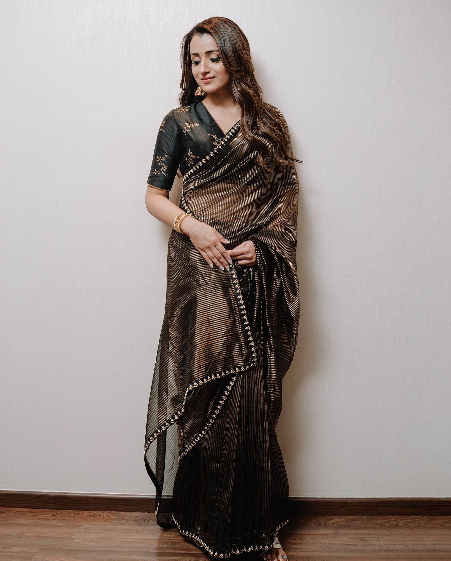 Trisha Krishnan Dazzling Look In Black & Gold Blend Organza Saree With V-Neck Blouse