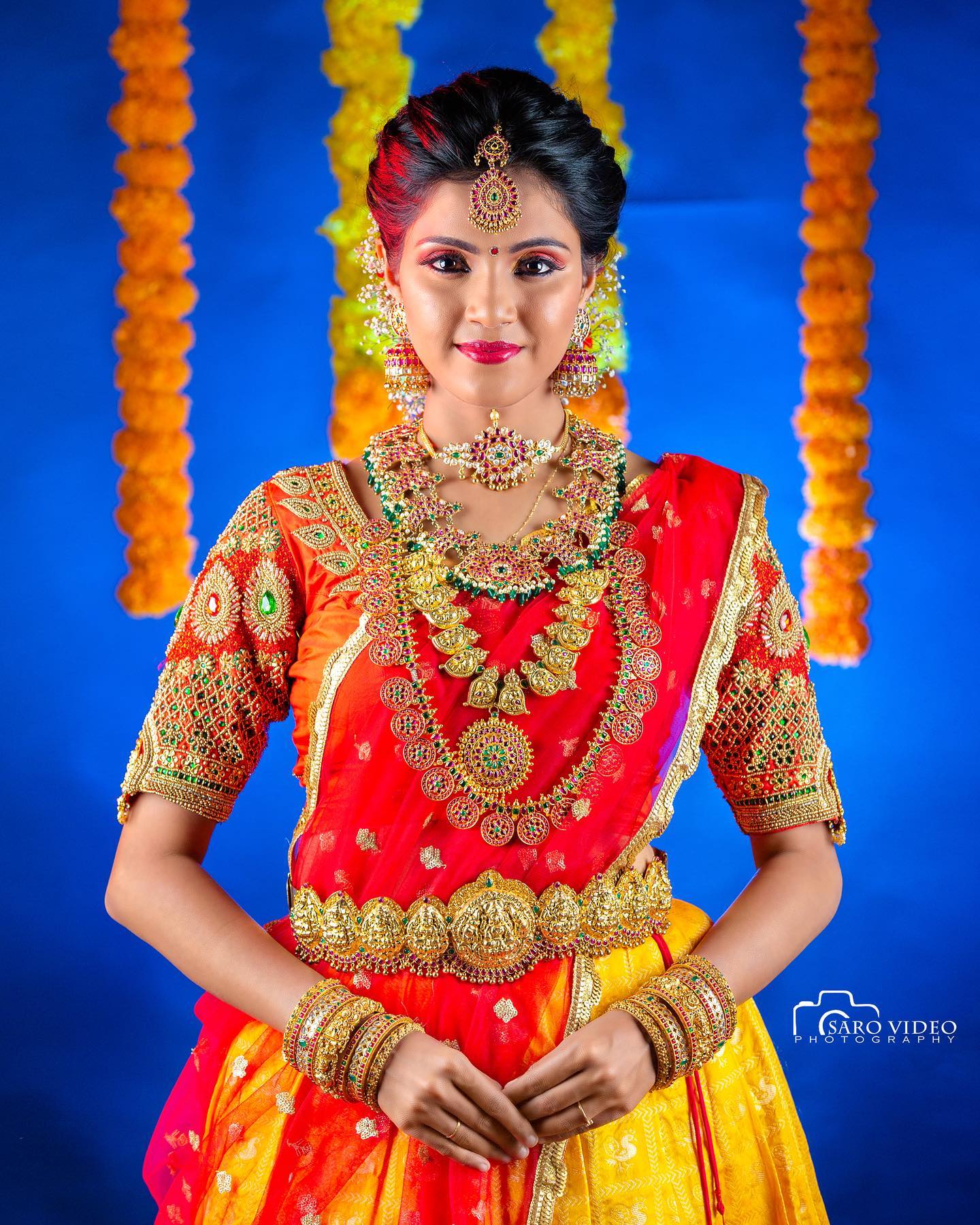 Vaishali Thaniga  In Traditional South Indian Bridal Look Wearing Yellow & Red Lehenga Saree
