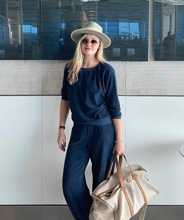 AJ Michalka Comfy Airport Look In Blue Jogger Set With Cool Hat & Sunglasses