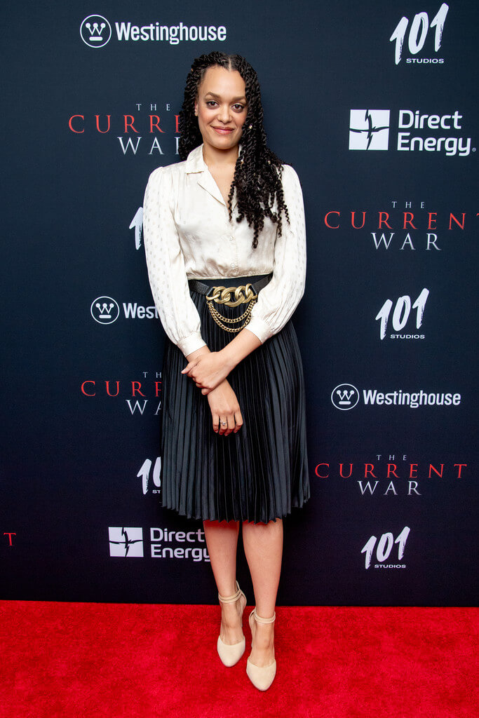 Actress Britne Oldford At "The Current War" New York Premiere In Cream Pleated Shirt And Black Skirt