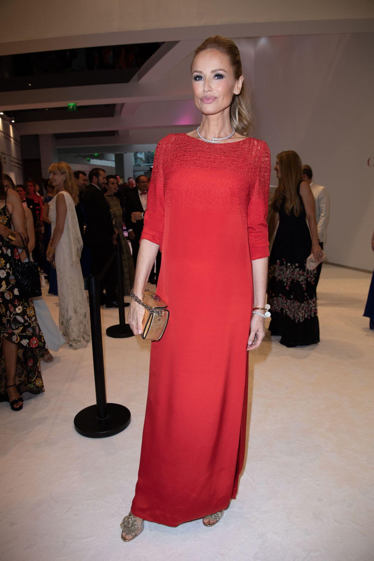 Adriana Karembeu In a Beautiful Red Gown With Pearl Necklace, Bracelet & Brown Leather Clutch