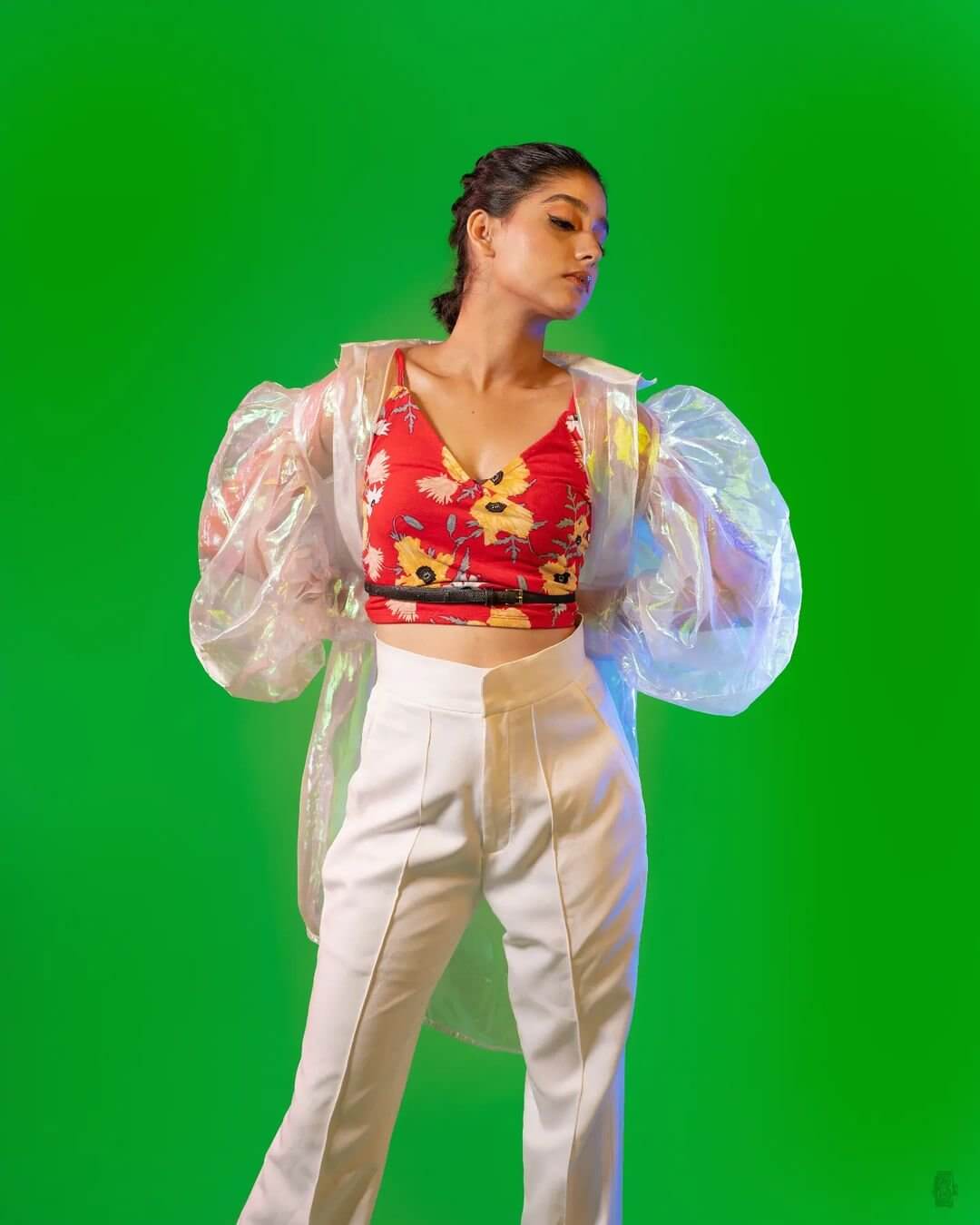 Anaswara Rajan Aces The Red Crop Top With White Pant Look With a Transparent Trench