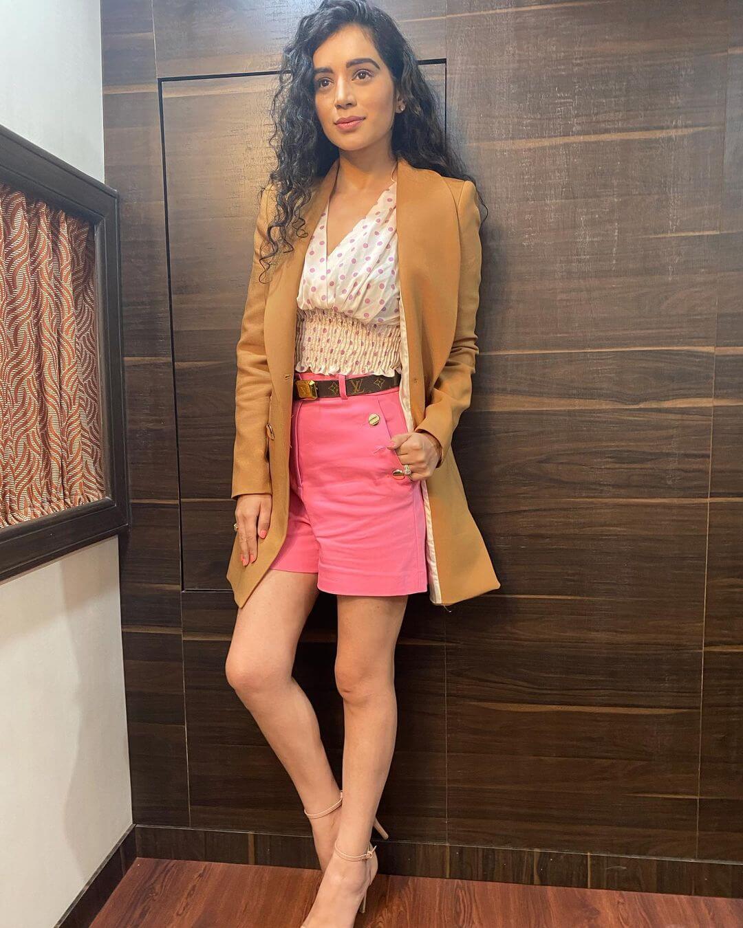 Beautiful Sukirti Kandpal In White Top With Pink Shorts Styled With Light Brown  Blazer