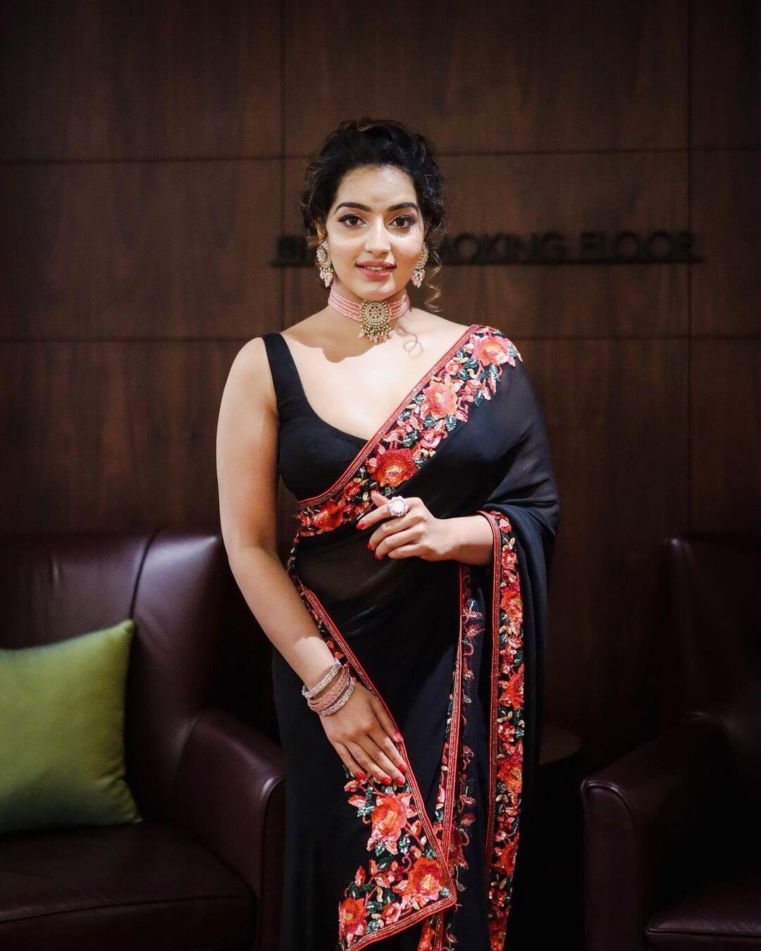 Malavika Menon Looks Drop Dead Gorgeous In Black Floral Embroidered Saree With Sleeveless Blouse