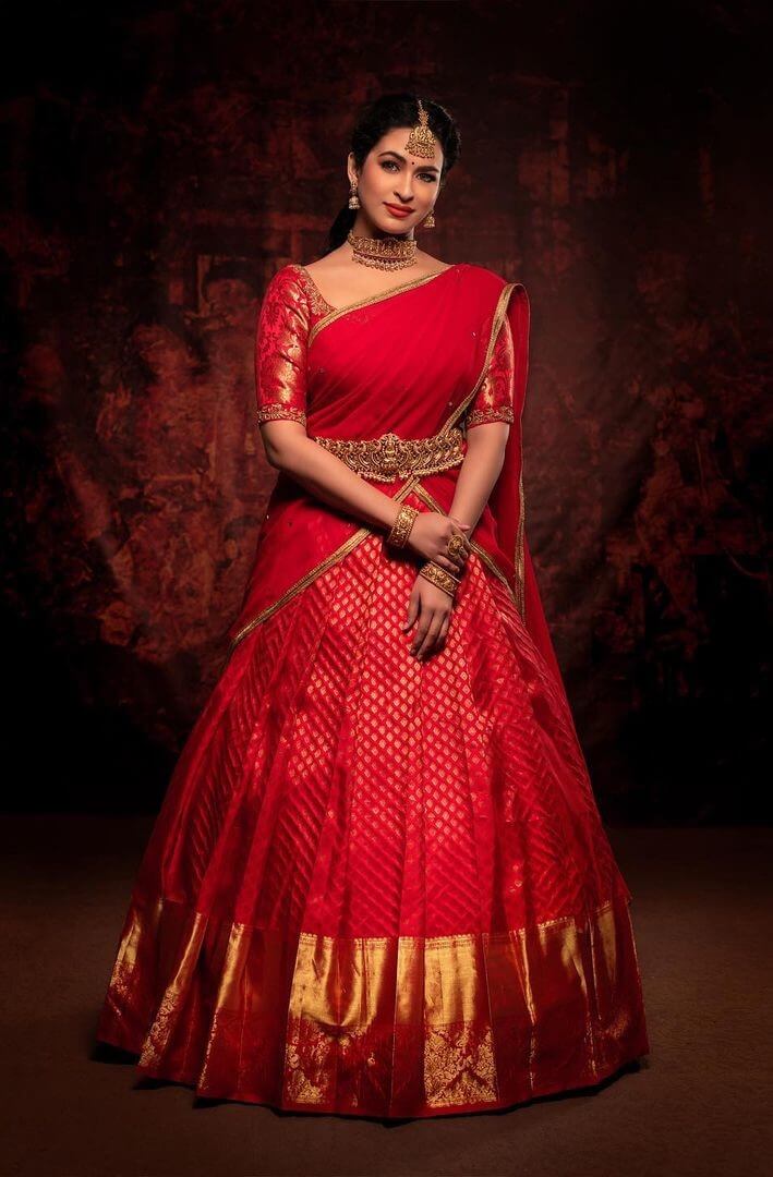 Misha Ghoshal In Red Bridal Lehenga Saree Look With Beautiful South Temple Design Kamarband & Jewellery