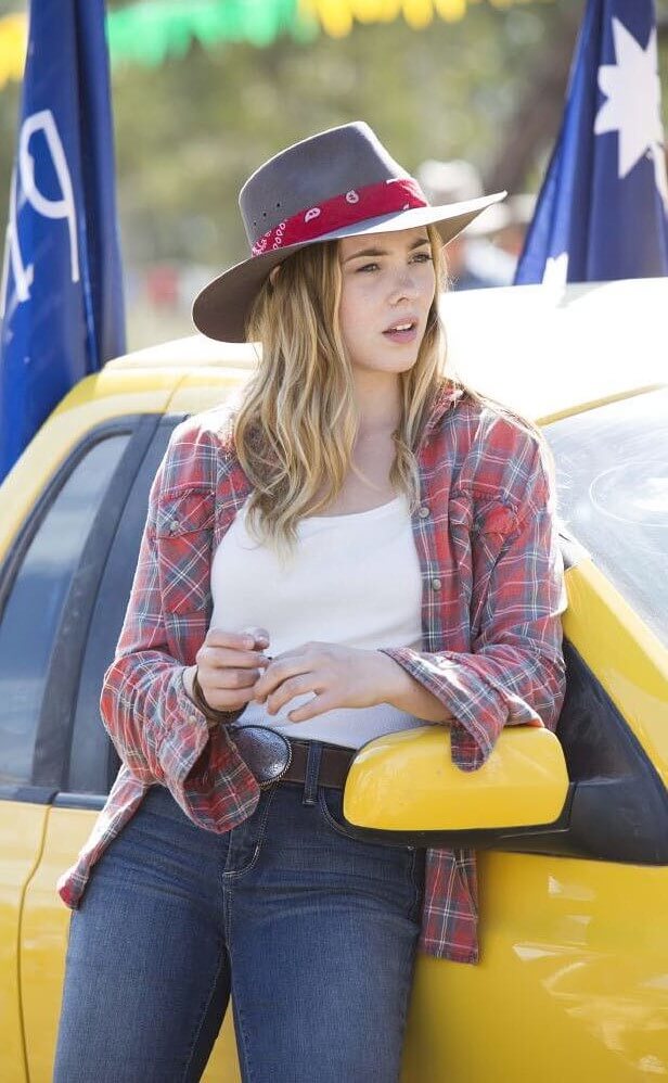 Morgan Griffin Cowboy Look Sexy in White Top With Blue Jeans and a Red & Blue Check Skirt
