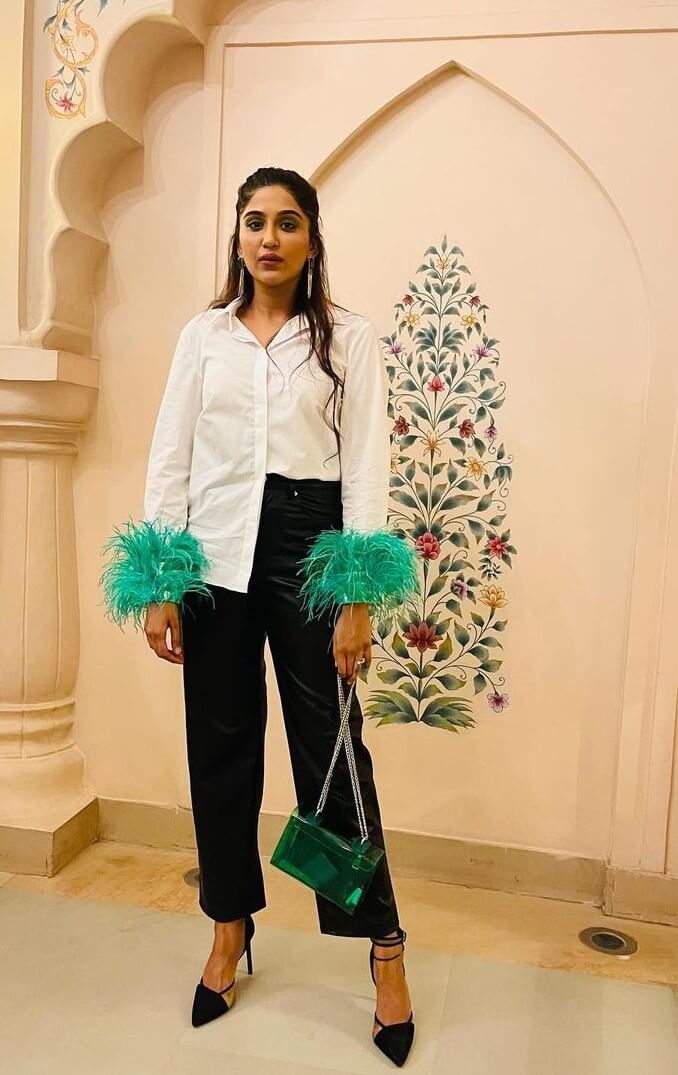 Nimrit Kaur Ahluwalia In Chic White Shirt With Feather Bracelet Cuffs Paired With Black Pants
