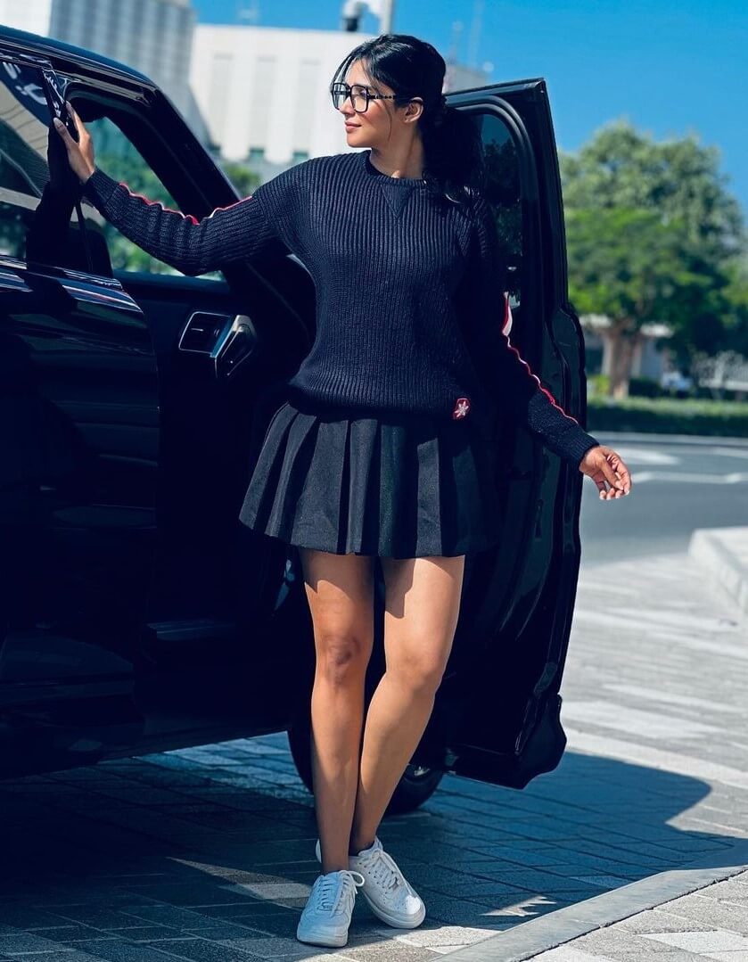 Nyla Usha Geky Look In Black Pullover With Pleated Short Skirt
