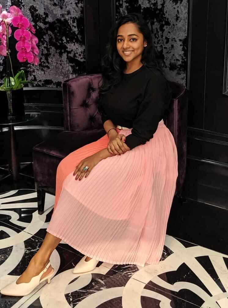 Santhy Balachandran Casual Look In Black Full Sleeves Top With Pleated Peach Long Skirt
