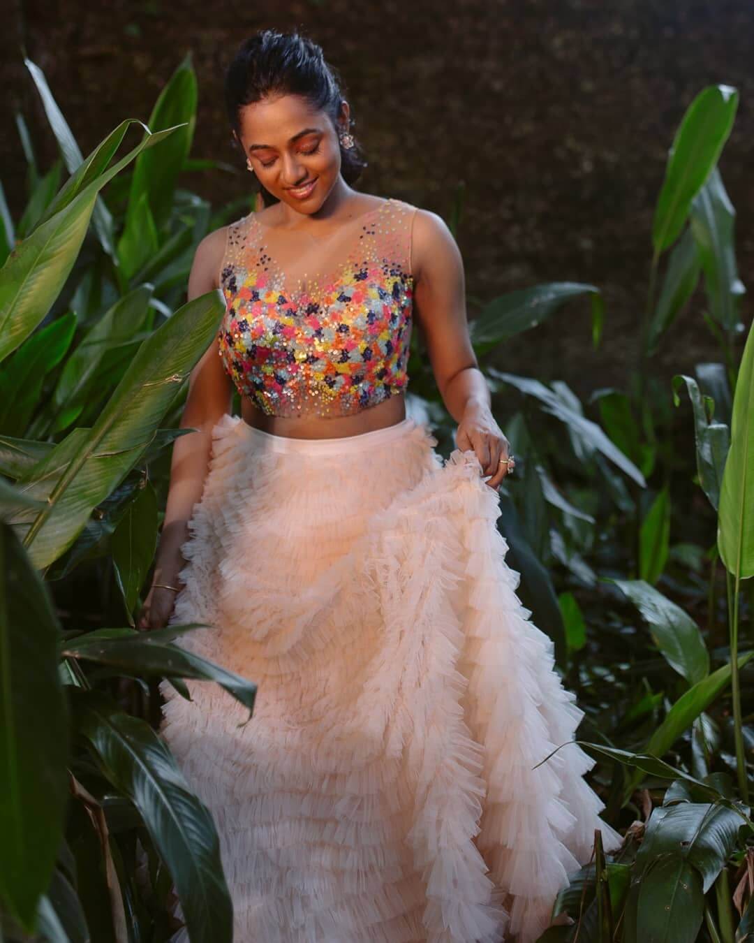 Santhy Balachandran In Beautiful Floral Embroidered Multi-Colour Blouse With Ruffled Long Skirt