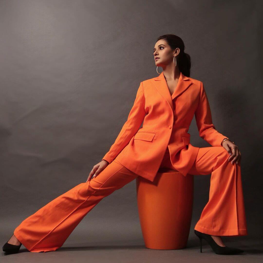 Shakti Mohan Strike A Pose In Orange Suit