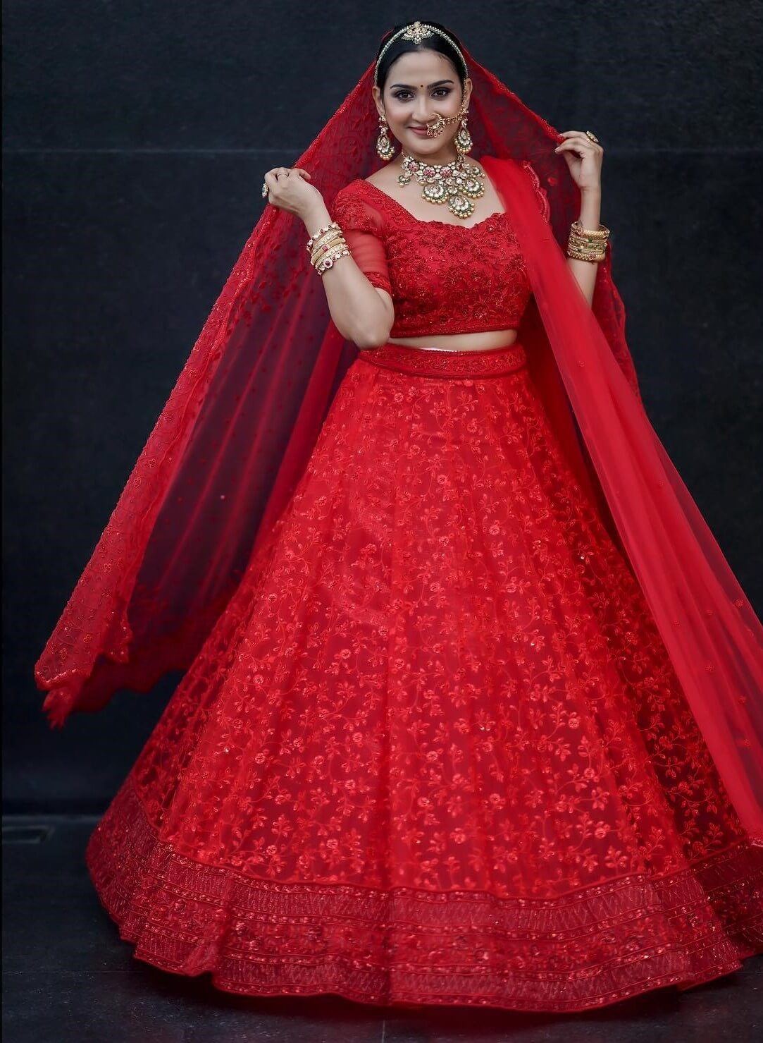 Aditi Ravi Regal Red Heavily Embellished Soft Net Lehenga Choli With Intricate Hand Embroidery Inspired Best Outfit & Looks Collection