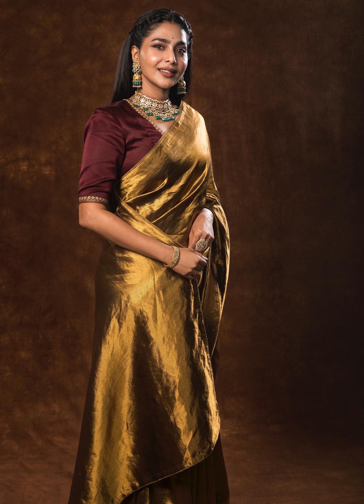 Aishwarya Lekshmi Dressed Up For Ponniyin Selvan: 2 Teaser Launch Event In Golden Silk Saree With Mauve Blouse
