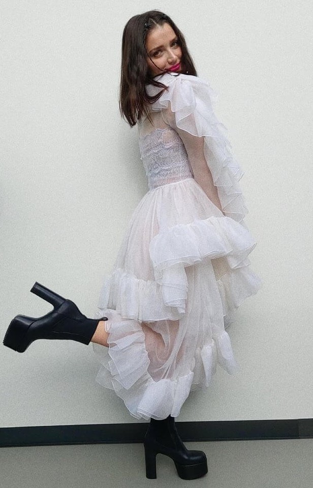 Bad Sister Fame Eve Hewson Look Pretty In White Ruffle Gown With Black Boots