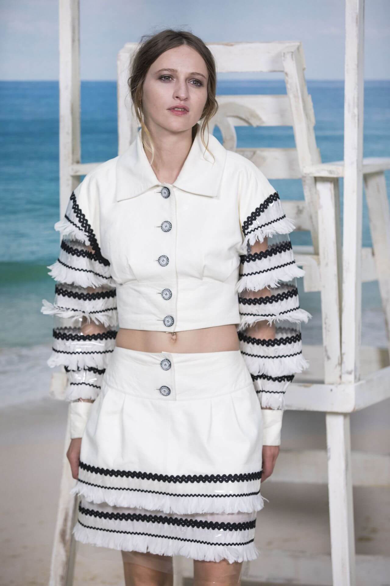 Christa Théret Dons In White Ensemble At Chanel Collection Show at Paris Fashion