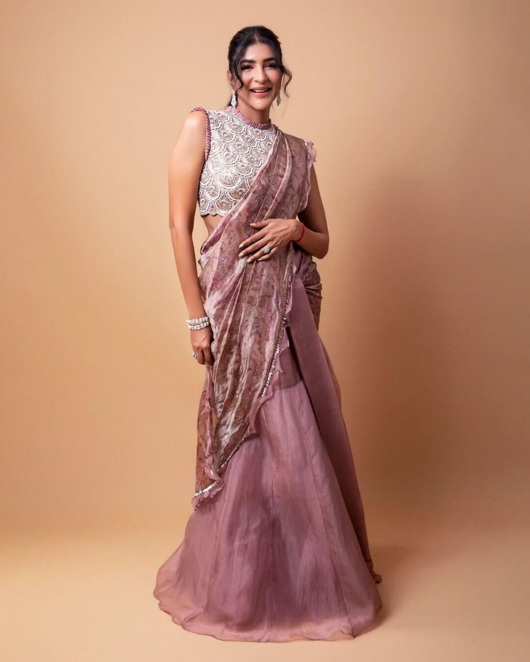 Fabulous Manchu Lakshmi  In Pastel Pink  Ruffled Saree With Embellished Designer Blouse