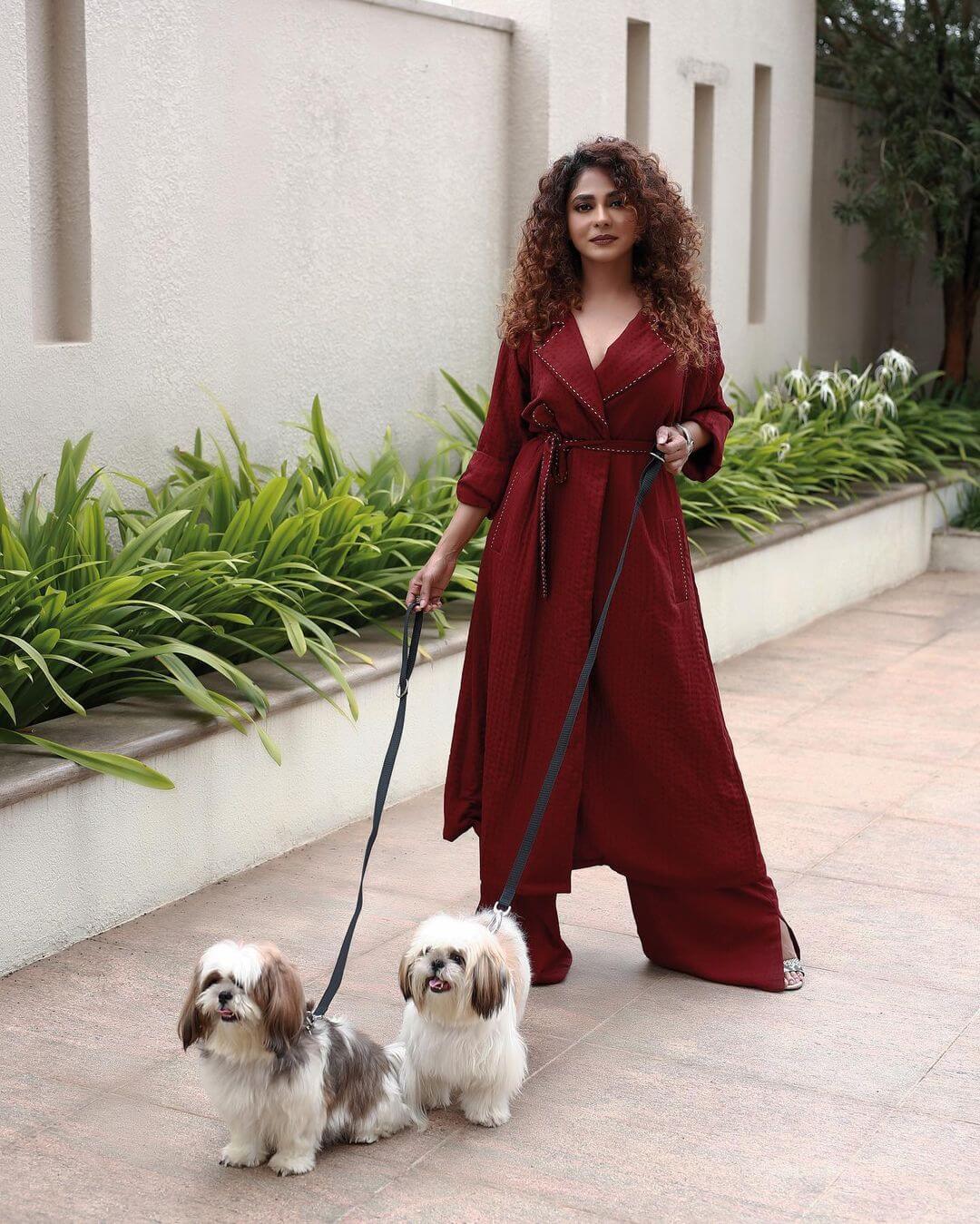 Poornima Indrajith Chic & Sexy Look In Red Trench With Flared Pants