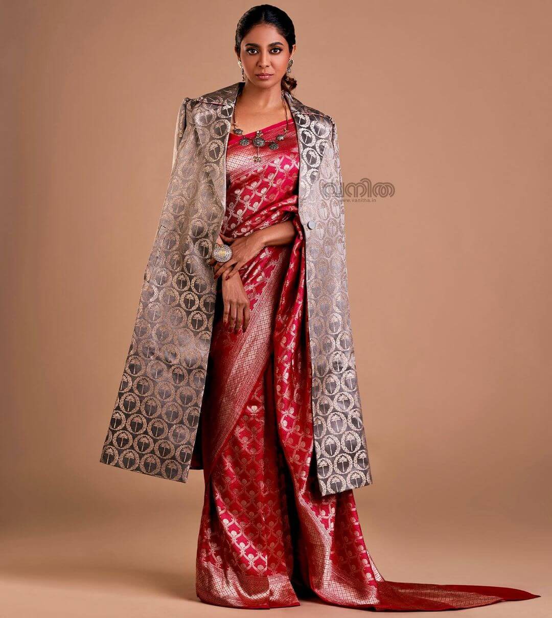 Poornima Indrajith Royal Banarasi Red Silk Saree Paired With Silver Jacket