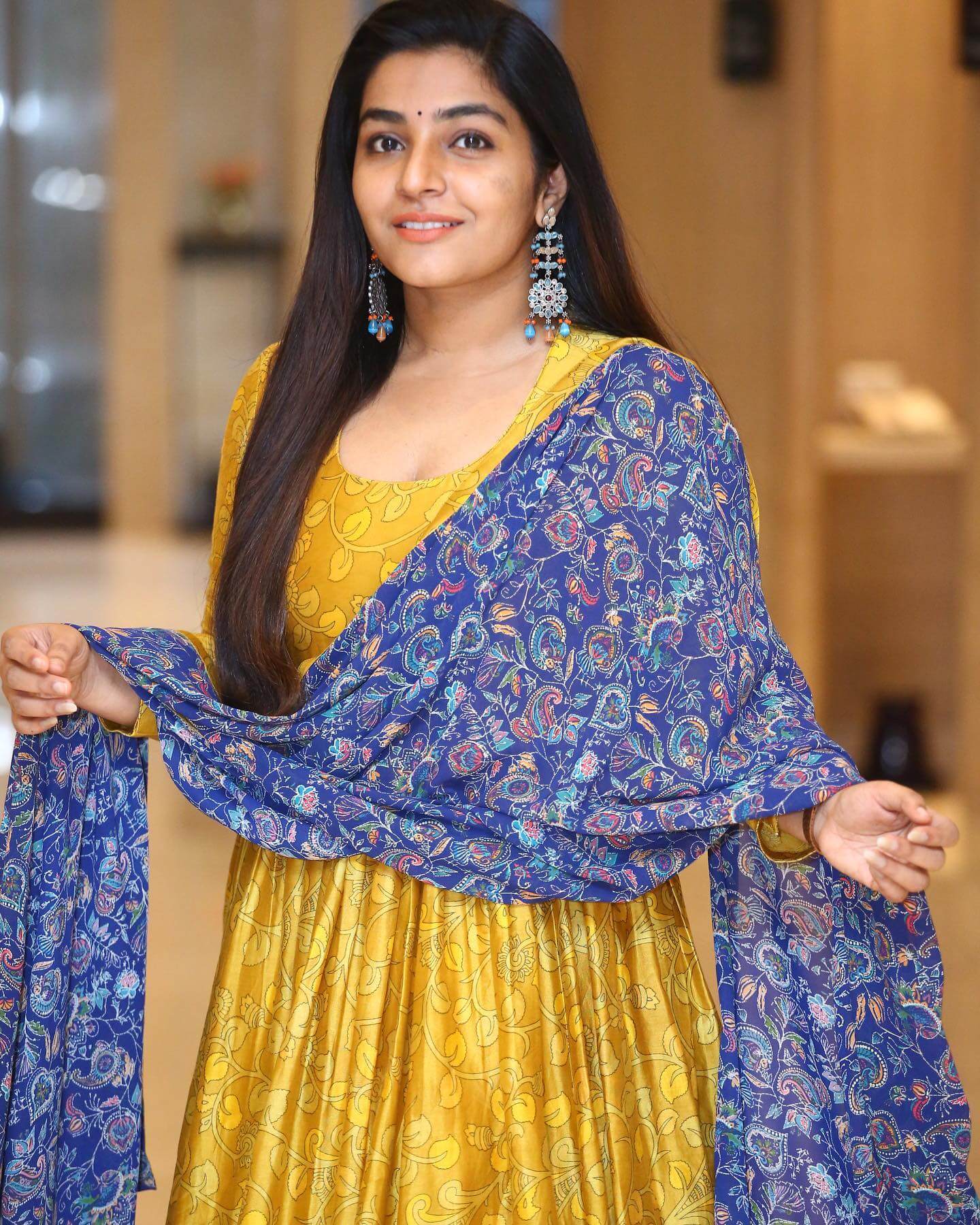 Rajisha Vijayan In Yellow Leafy Printed Frock Suit With Printed Blue Dupatta