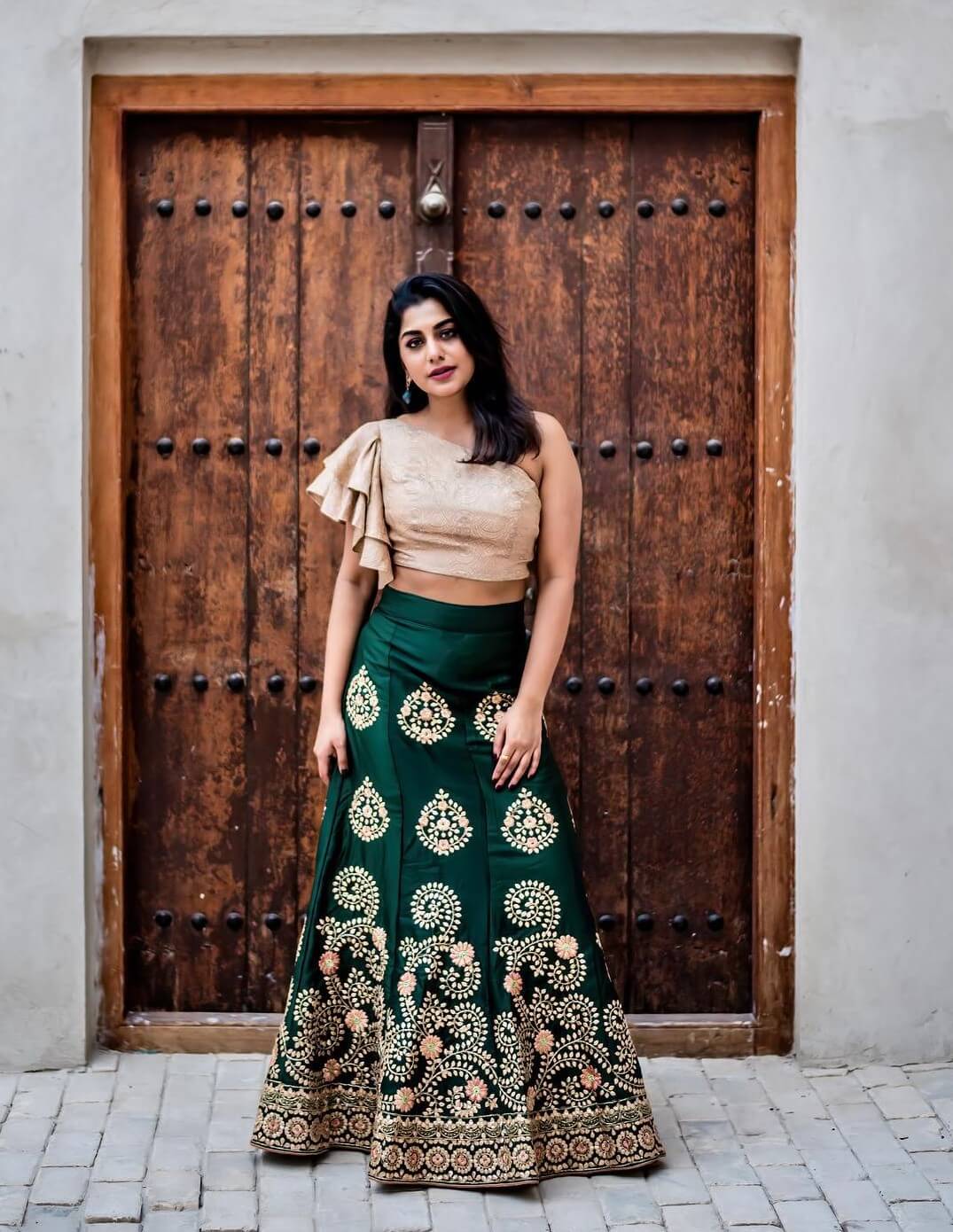 RJ Meera Nandan  In Golden One Shoulder Crop Top With Bottle Green Embroidered Lehenga Glamorous Western & Traditional Outfits & Looks