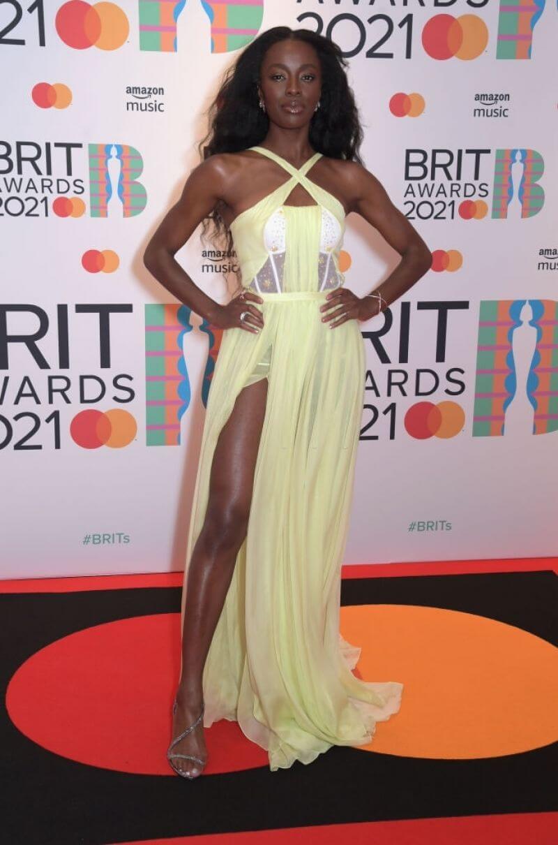 AJ Odudu – In A Yellow Sheering Long Dress -  BRIT Awards