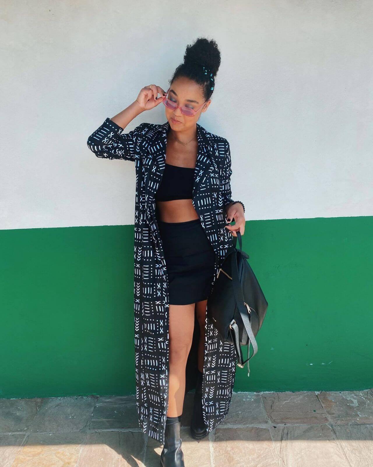Aisha Dee In A Printed Long Jacket With A Crop Top &Short Skirt