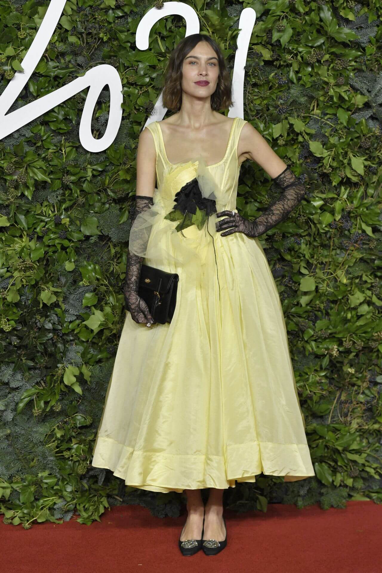 Alexa Chung wears looks like yellow Gown outfit at Fashion Awards 