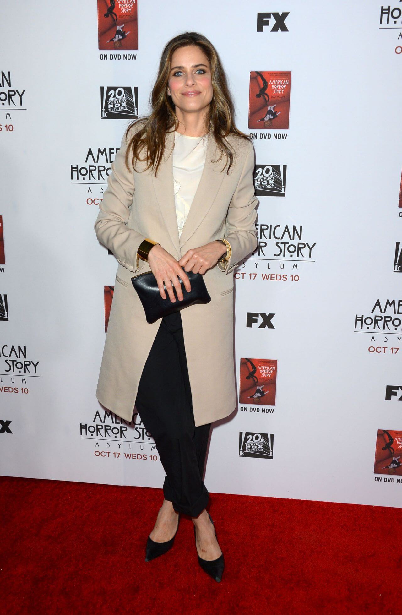 Amanda Peet In Golden Beige Long Coat & Off White Top With Black Pants At  FX’s “American Horror Story Asylum”