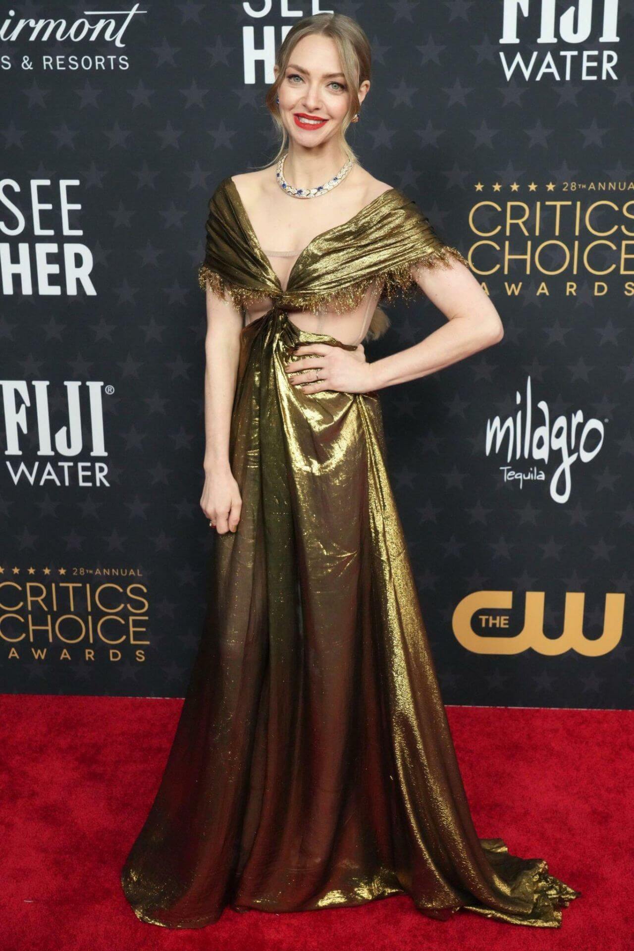 Amanda Seyfried Glow In Golden Shiny Cut-Out Long Gown With Diamond Necklace At  Critics Choice Awards