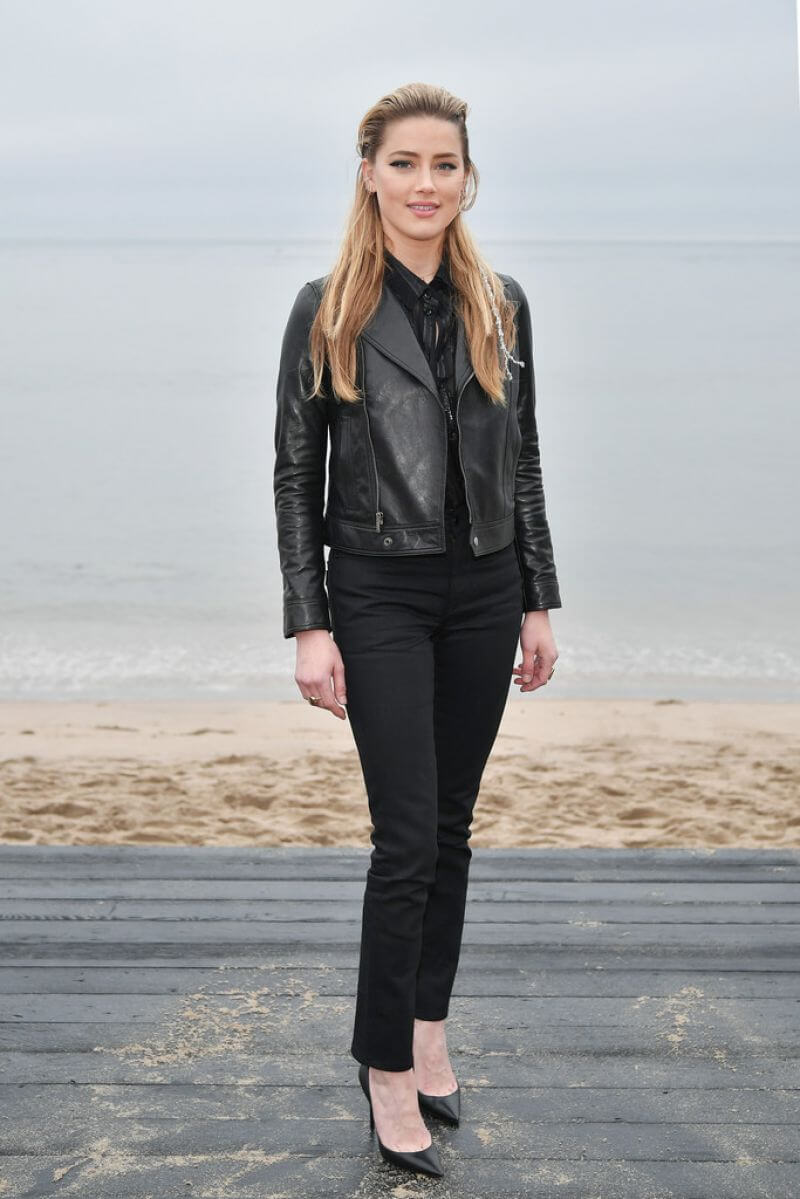 Amber Heard In Black Shirt & Leather Jacket With Jeans At Saint Laurent Mens S/S 20 Show Photocall in Malibu