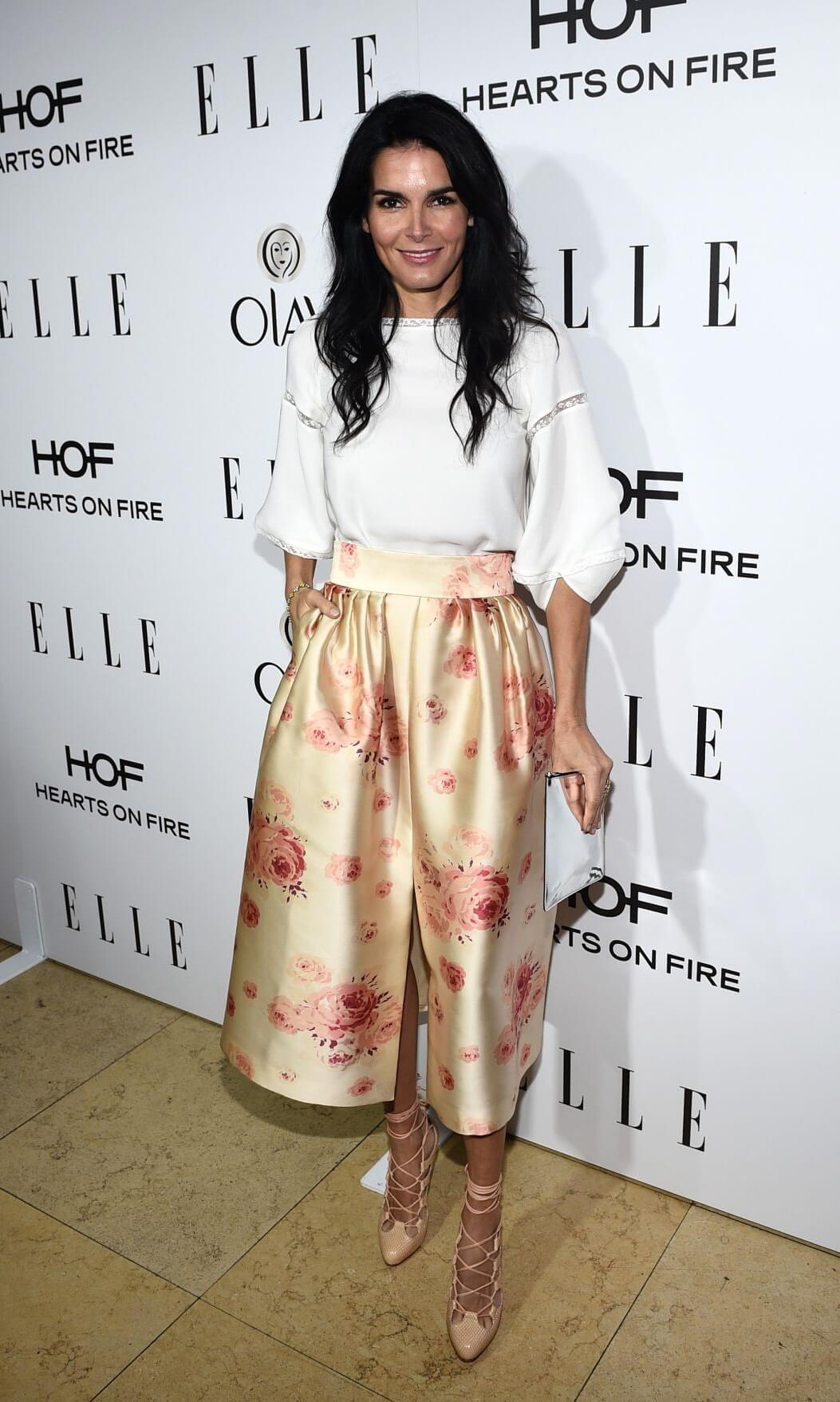 Angie Harmon  In White Baggy Sleeves Top With Satin Printed Skirt Outfits At ELLE’s  Women in Television Celebration in West Hollywood